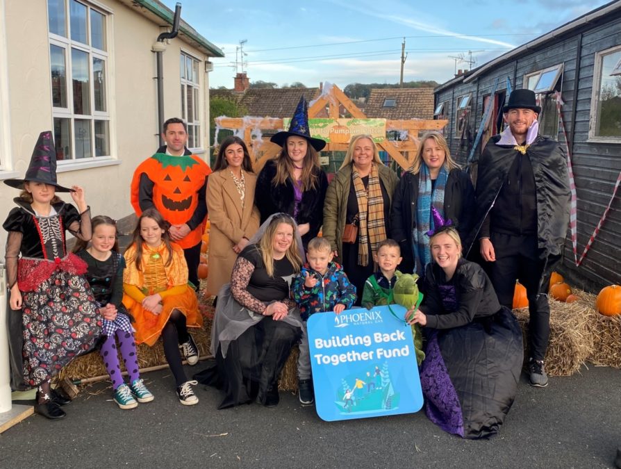 Cllr Oonagh Hanlon with representatives of the Flying Horse Ward Community Forum and young people enjoying the Halloween trail.