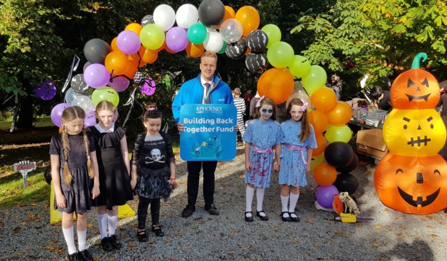 Jonathan King, Phoenix Natural Gas Energy Advisor, with some of the pupils from St Brigid’s Primary School, Downpatrick at the school’s spooky trail which was supported by the Phoenix Natural Gas Building Back Together Fund.